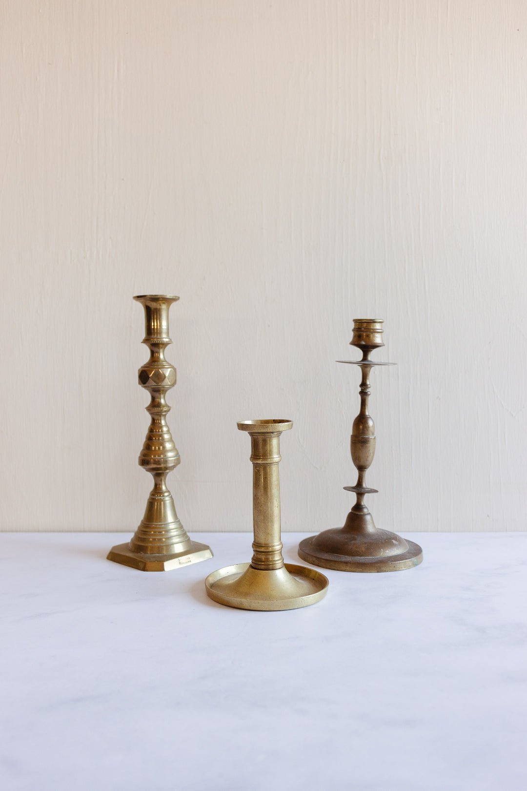 eclectic set of 3 vintage brass candlesticks