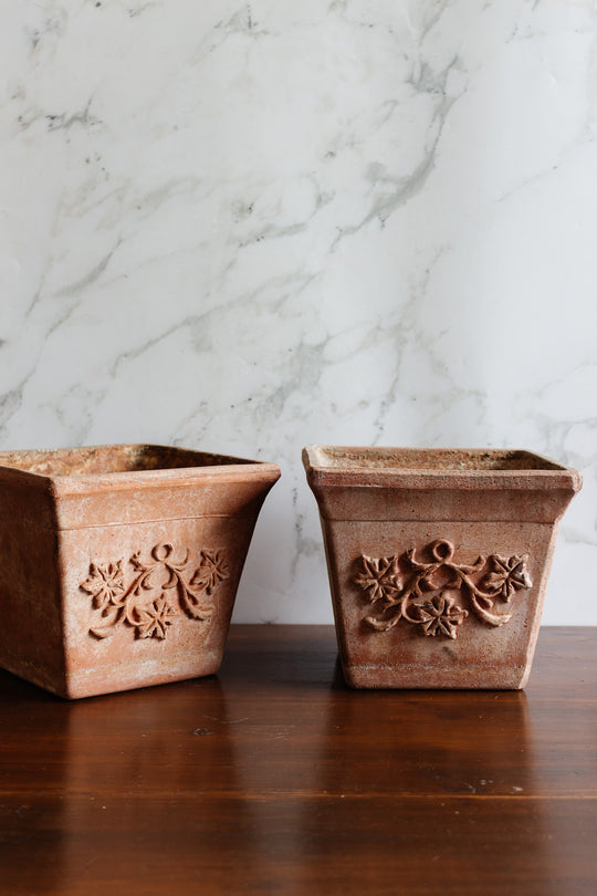 pair of vintage french terra cotta planters with relief detail