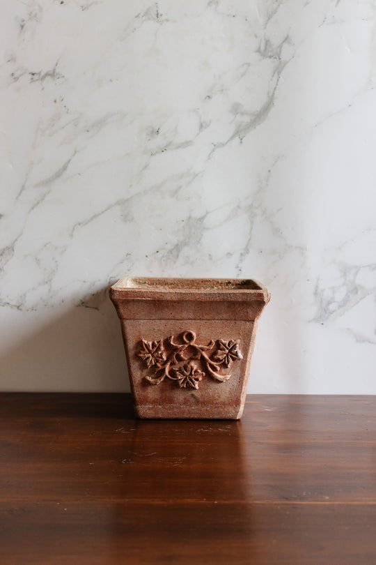 pair of vintage french terra cotta planters with relief detail