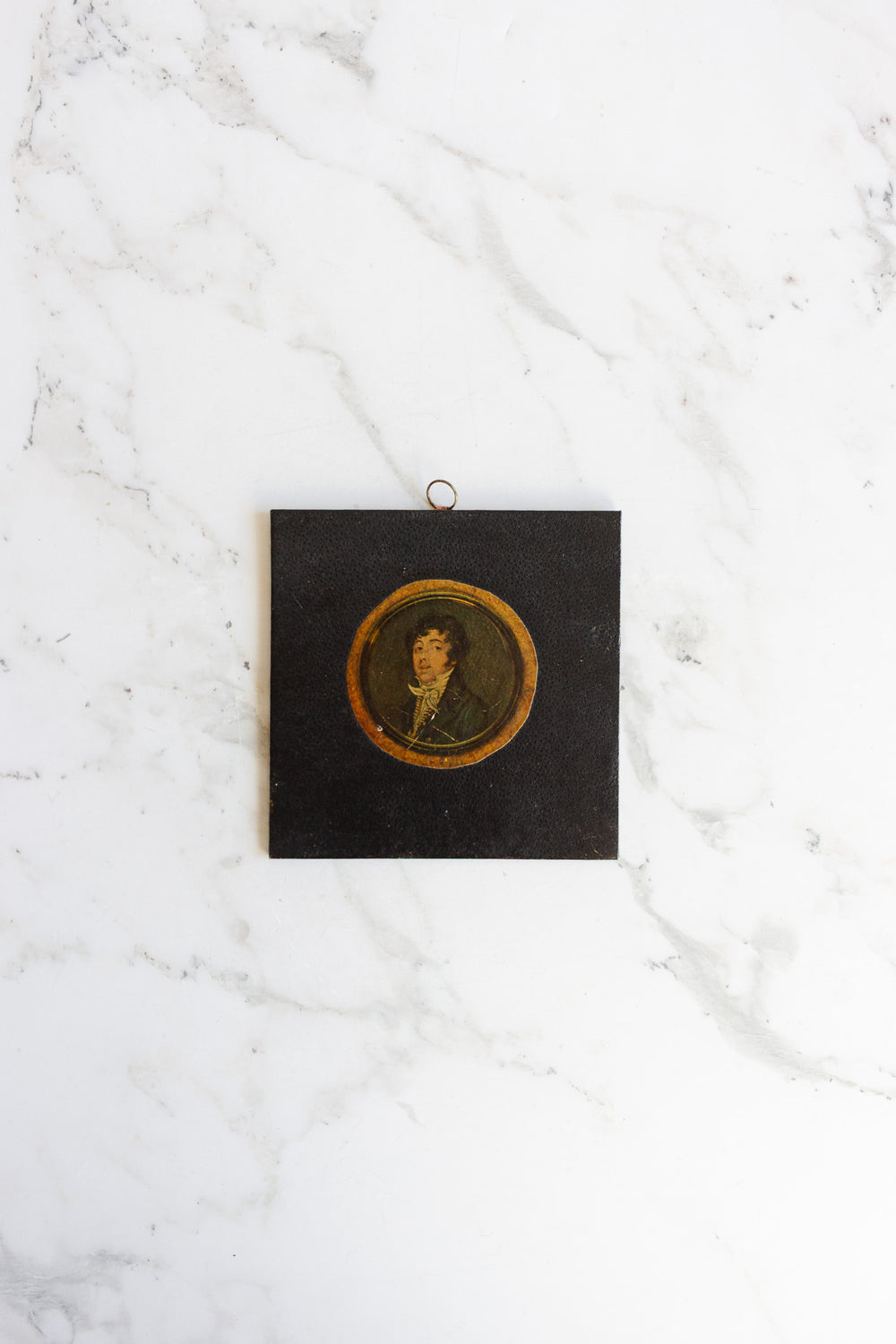 pair of vintage leather framed portraits