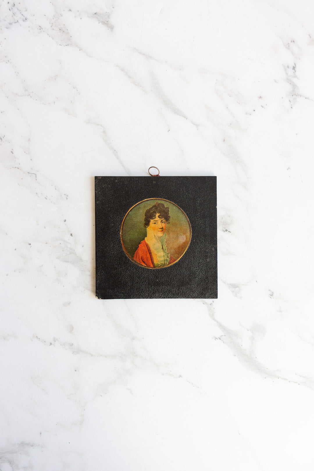 pair of vintage leather framed portraits