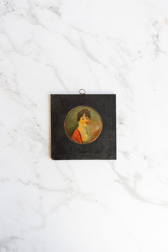 pair of vintage leather framed portraits