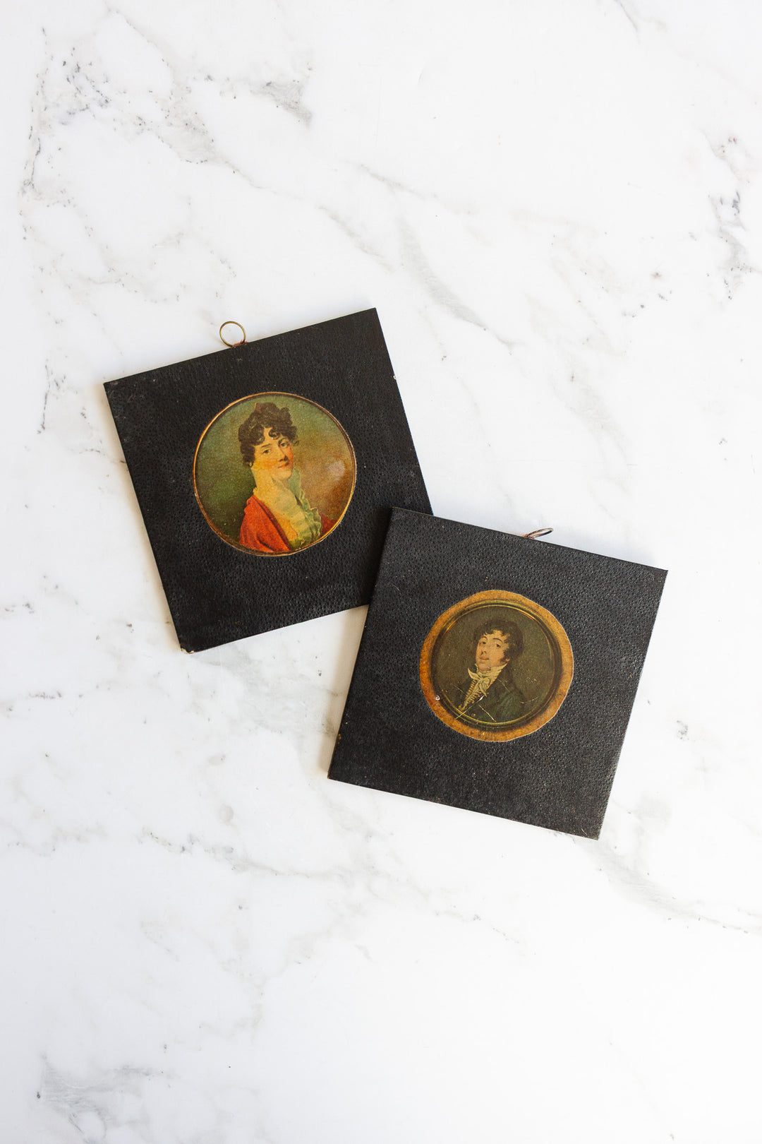 pair of vintage leather framed portraits