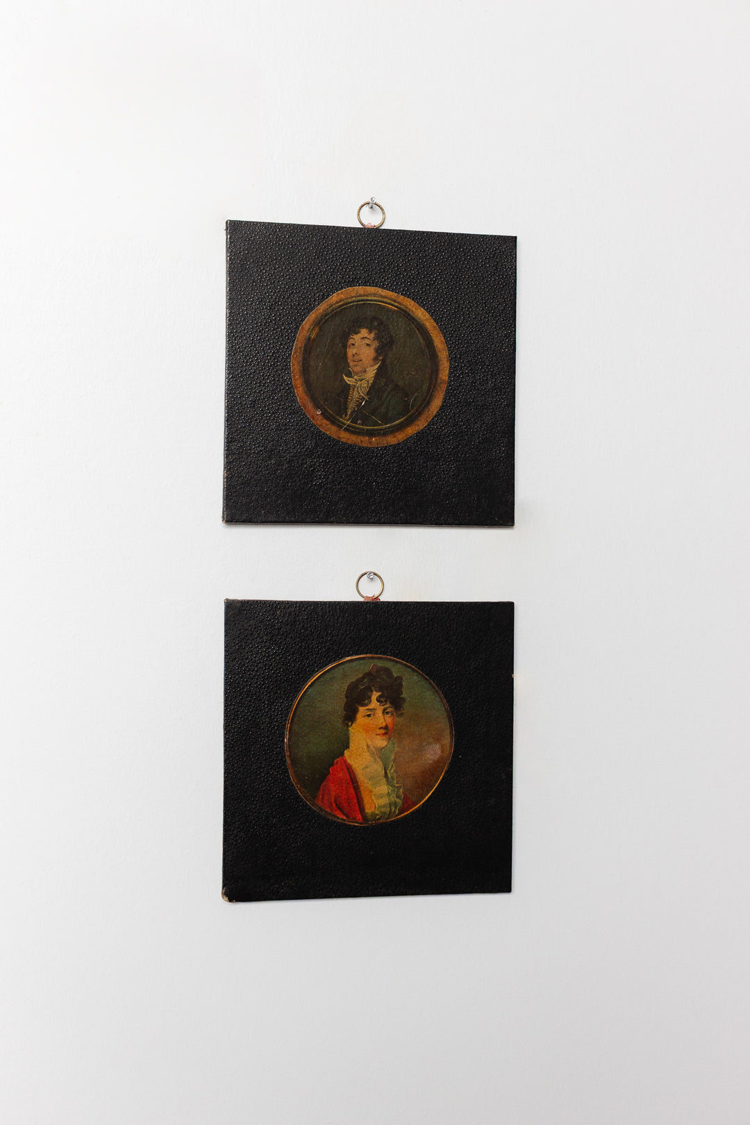pair of vintage leather framed portraits