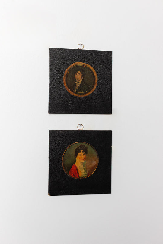 pair of vintage leather framed portraits