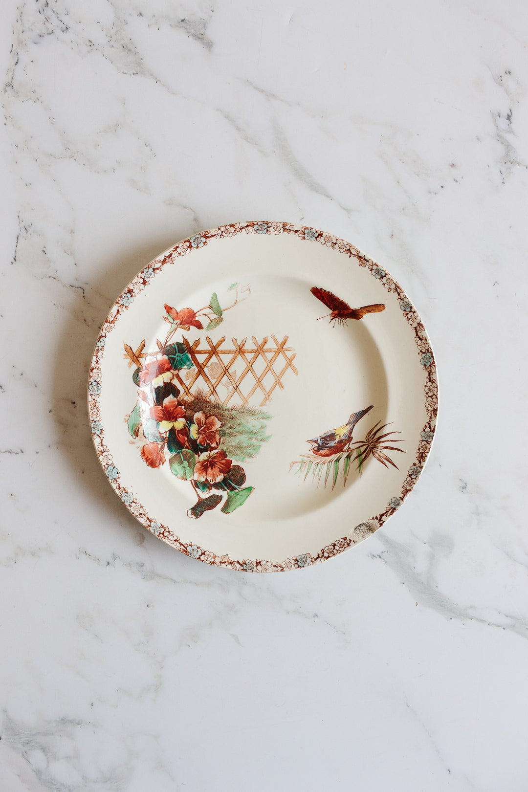 1880s french terre de fer polychrome plate commissioned by Grand Dépôt