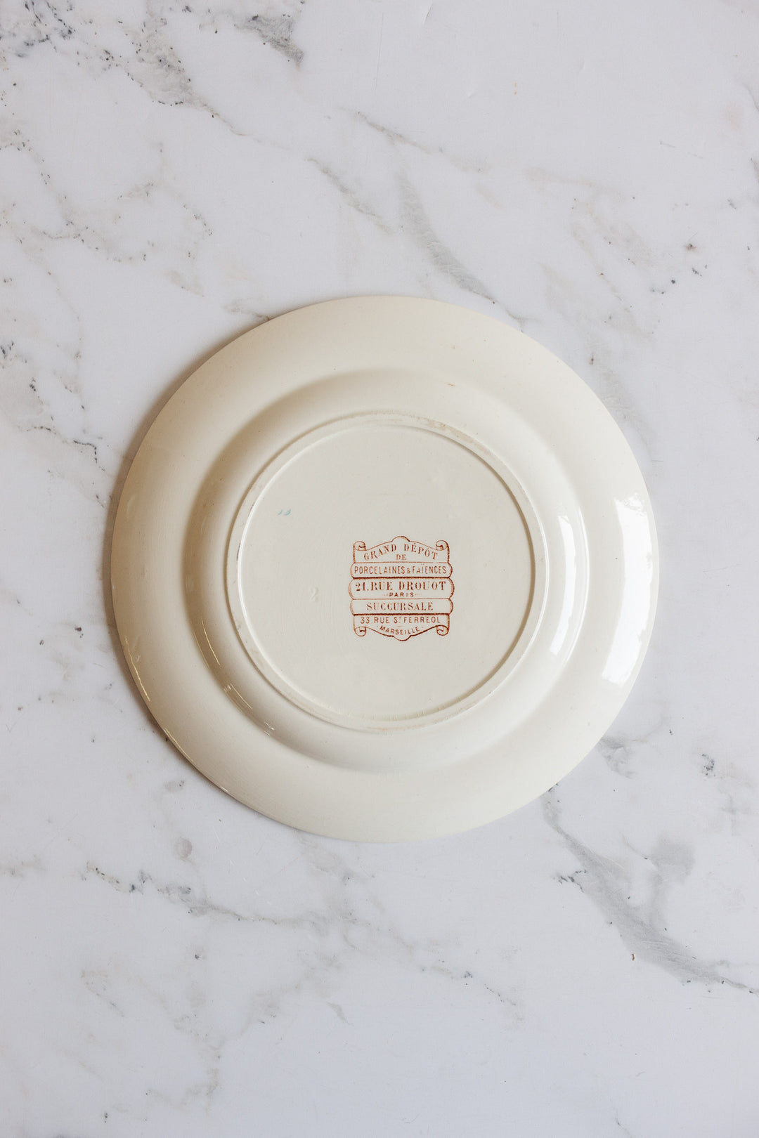 1880s french terre de fer polychrome plate commissioned by Grand Dépôt