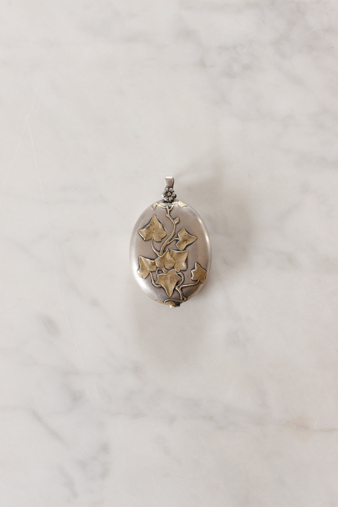 turn of the century French silver repousse art nouveau slide locket