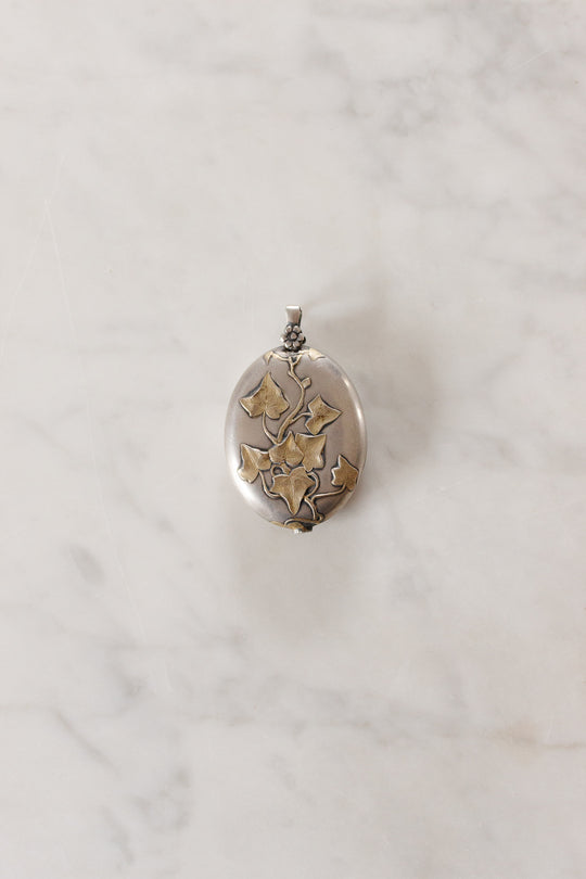 turn of the century French silver repousse art nouveau slide locket