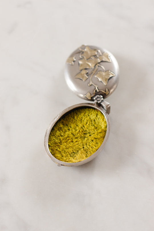 turn of the century French silver repousse art nouveau slide locket