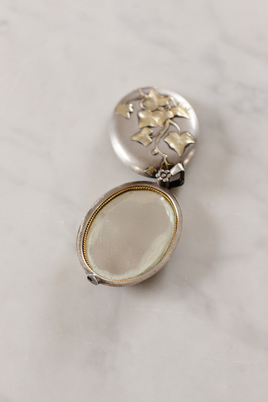 turn of the century French silver repousse art nouveau slide locket