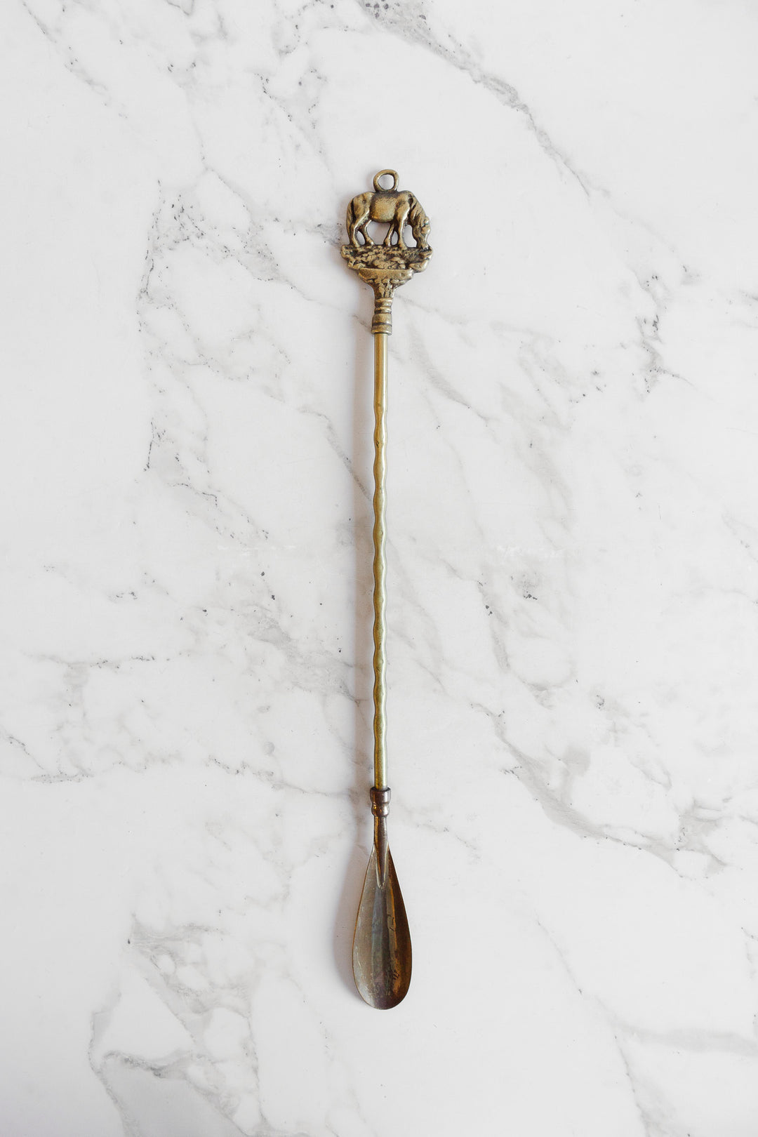 antique brass shoe horn: elephant or horse