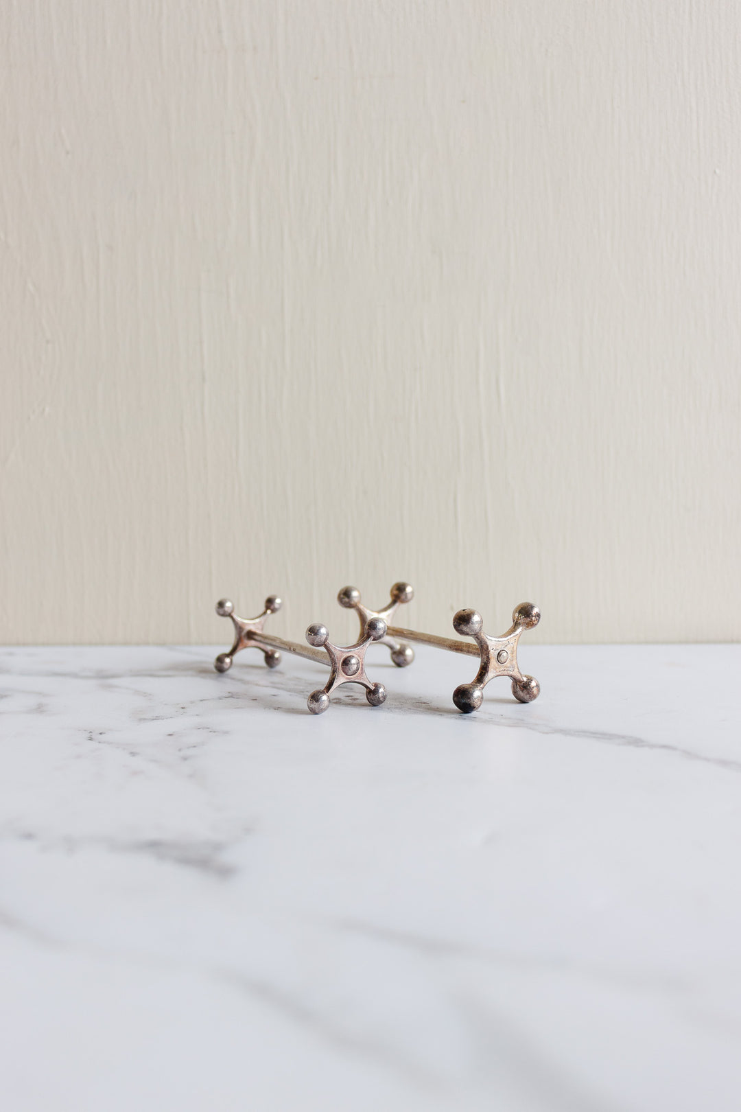 vintage french silverplated cogged knife rests, set of 7