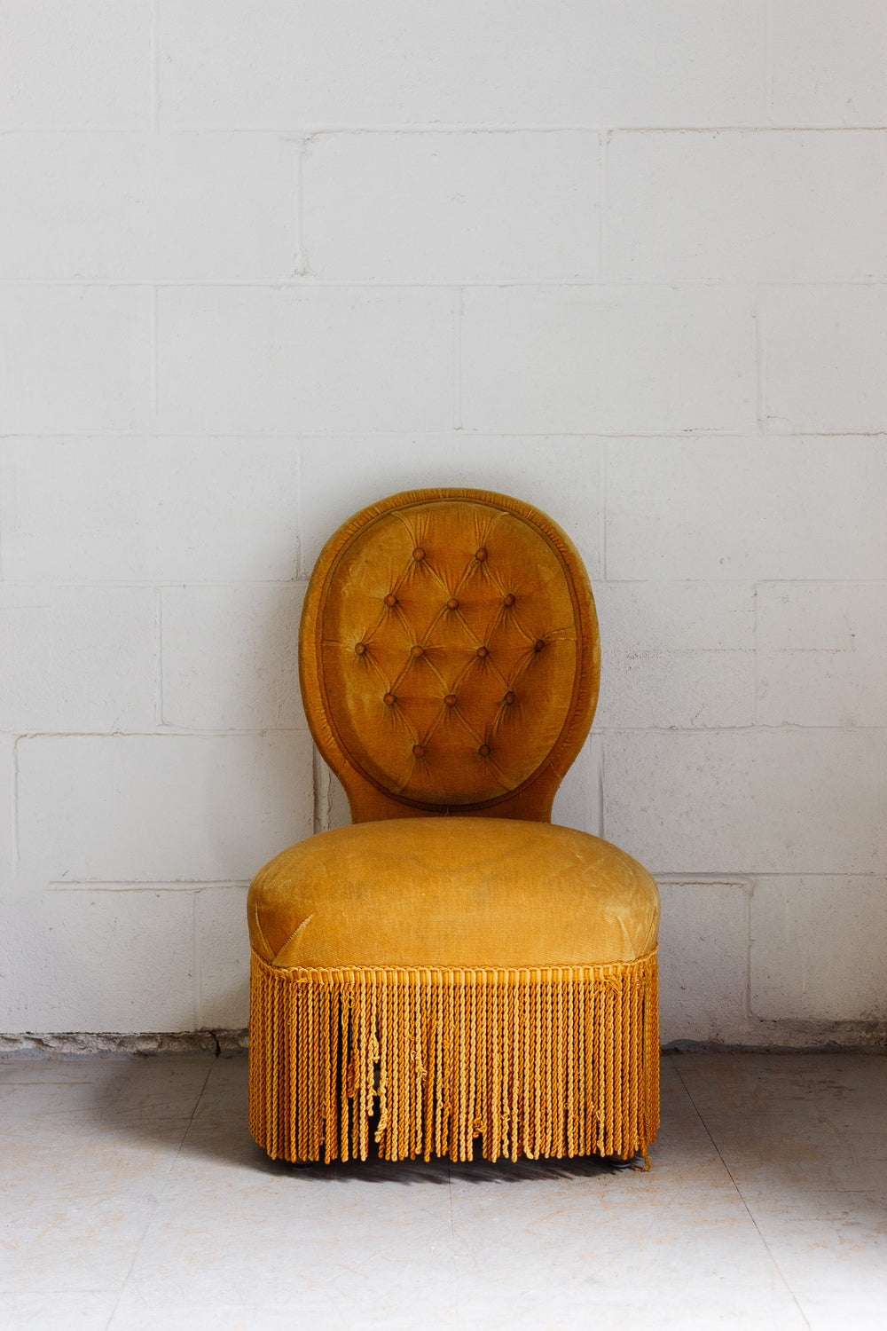 midcentury french golden slipper chair with fringe