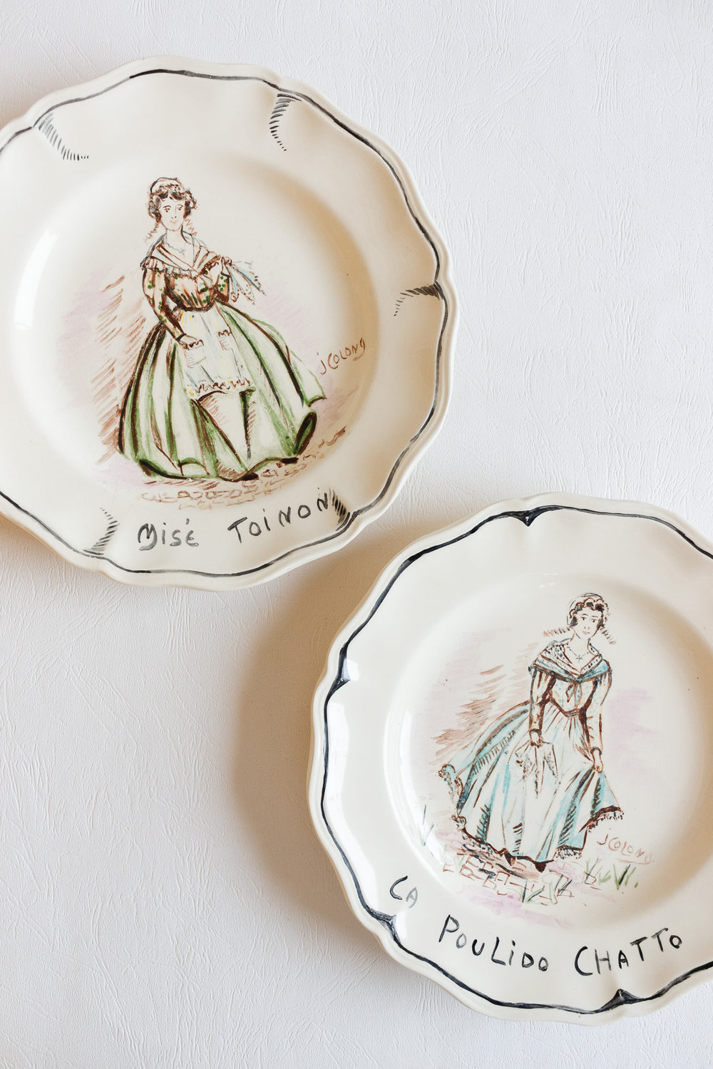 pair of 1920s sarreguemines talking plates, design by j colong