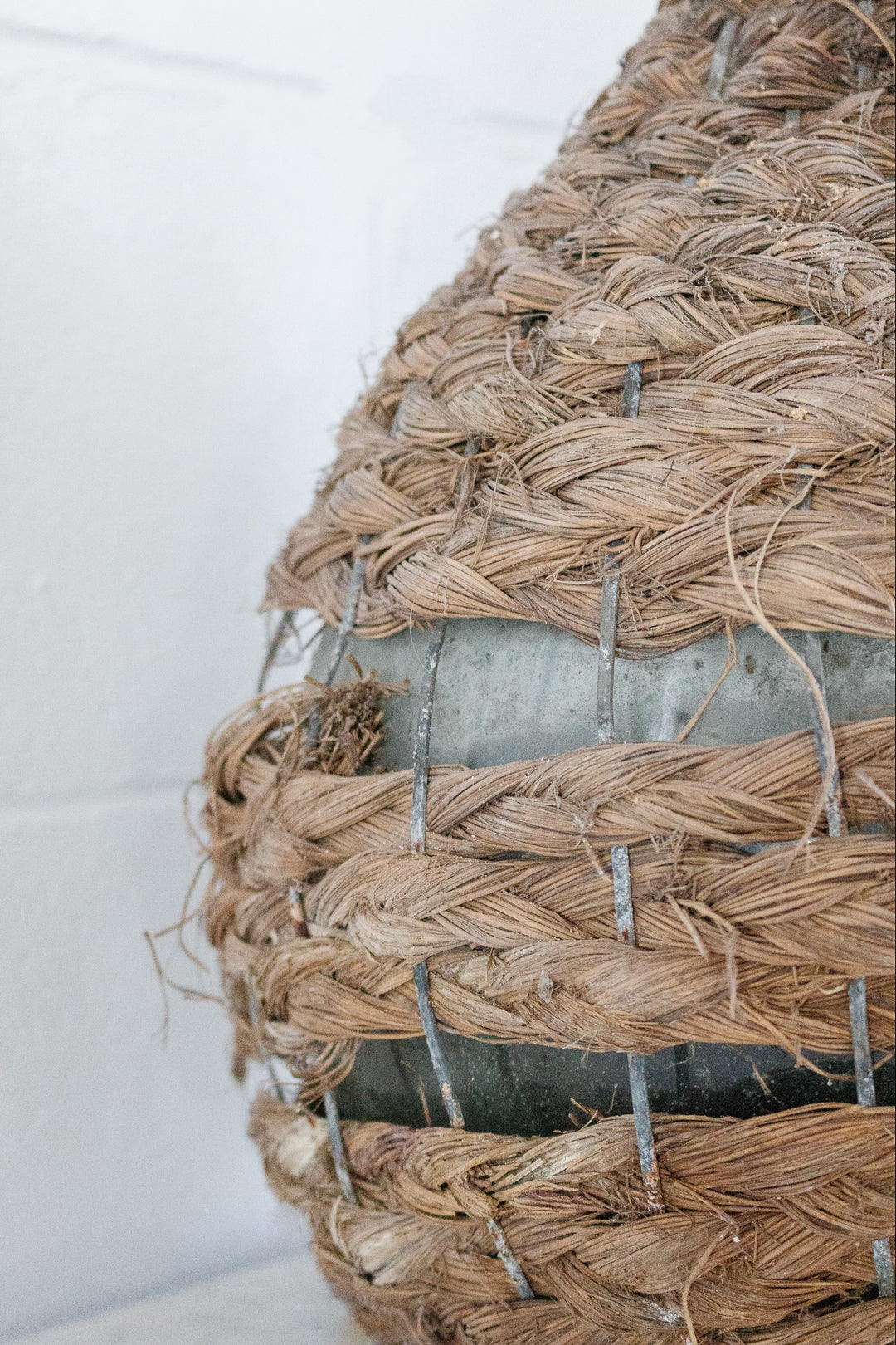 antique french wicker wrapped demijohn