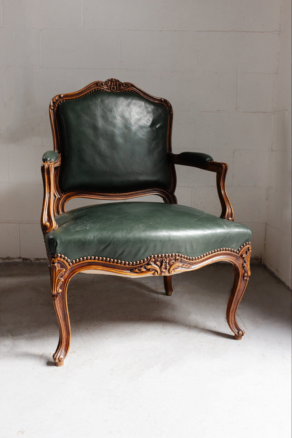 Louis XV carved walnut & leather armchair