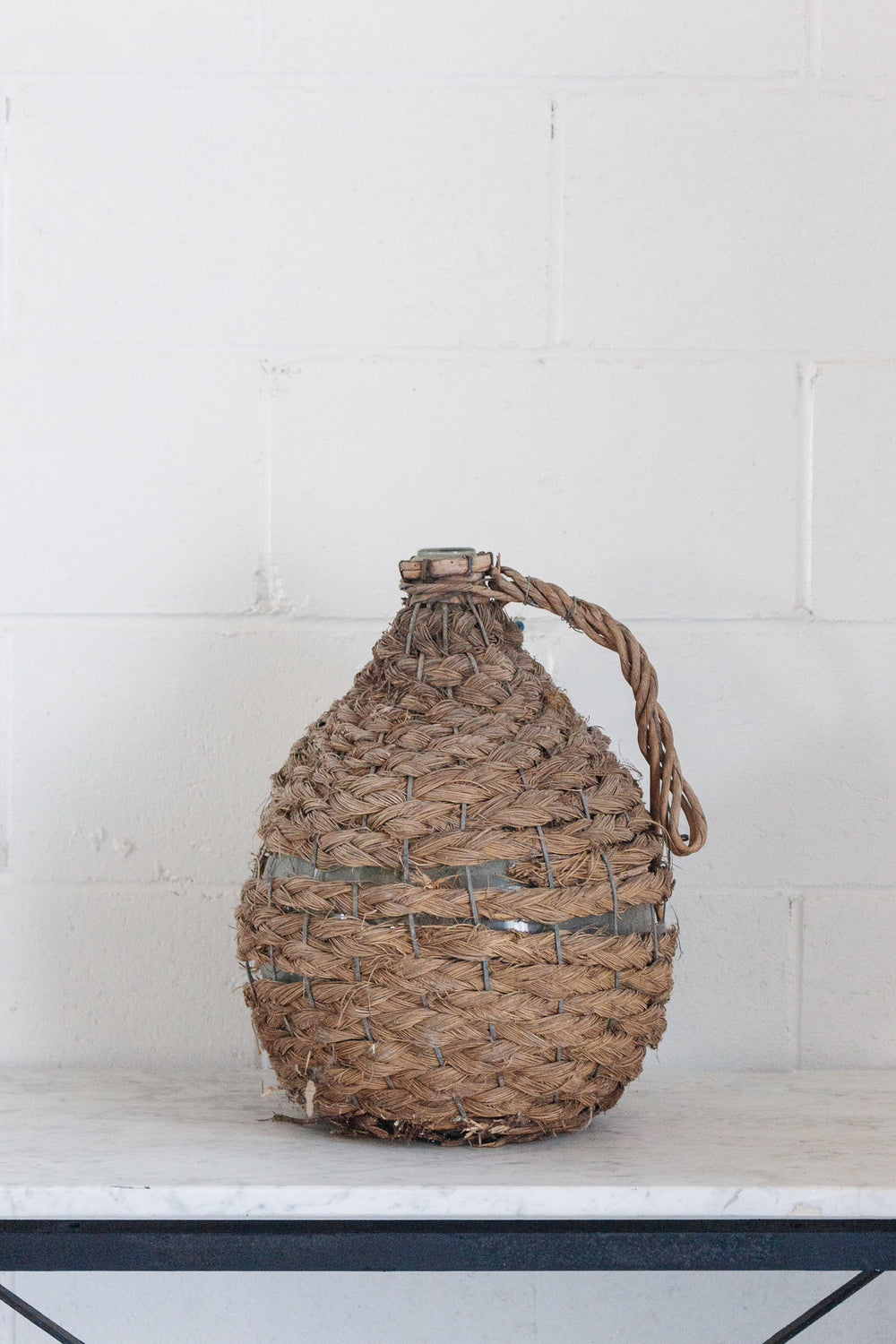 antique french wicker wrapped demijohn