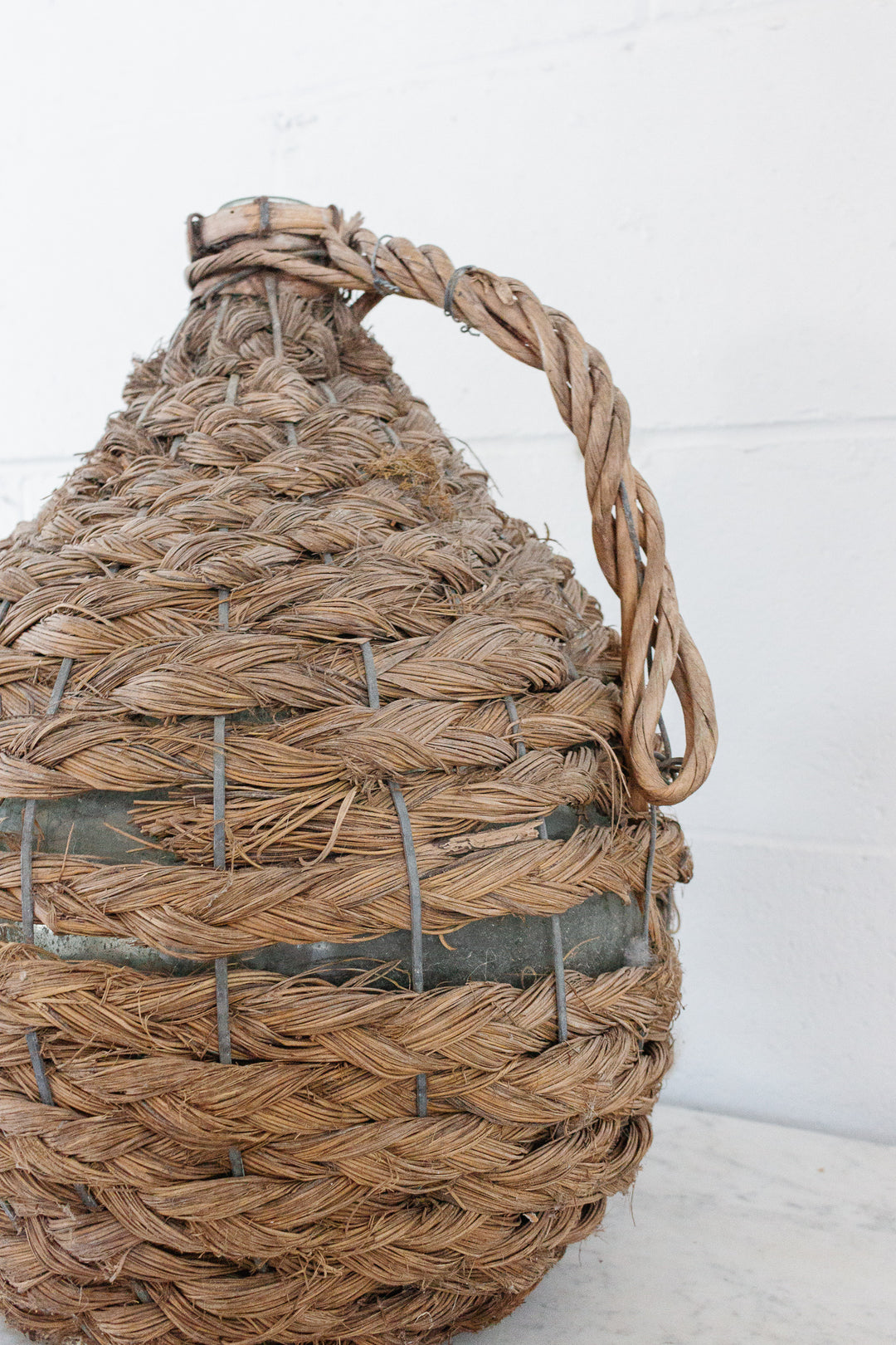 antique french wicker wrapped demijohn