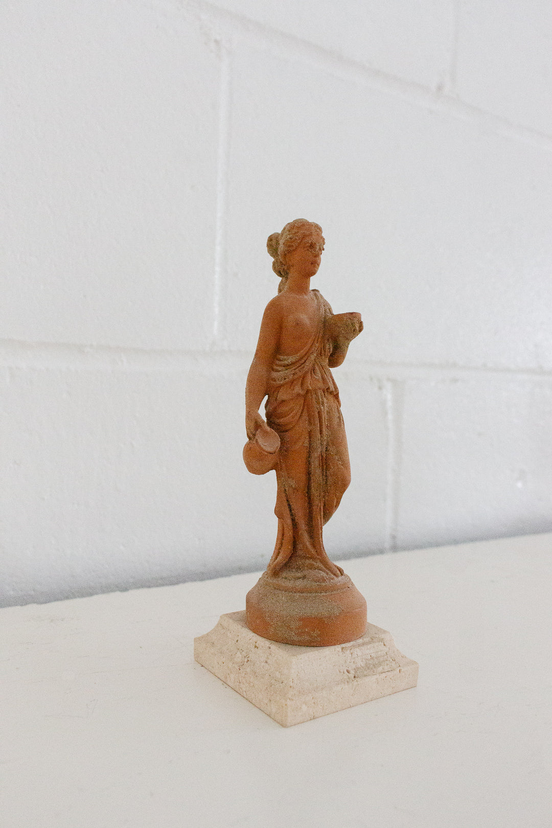 vintage Italian Grecian terra cotta sculptures with tivoli travertine base