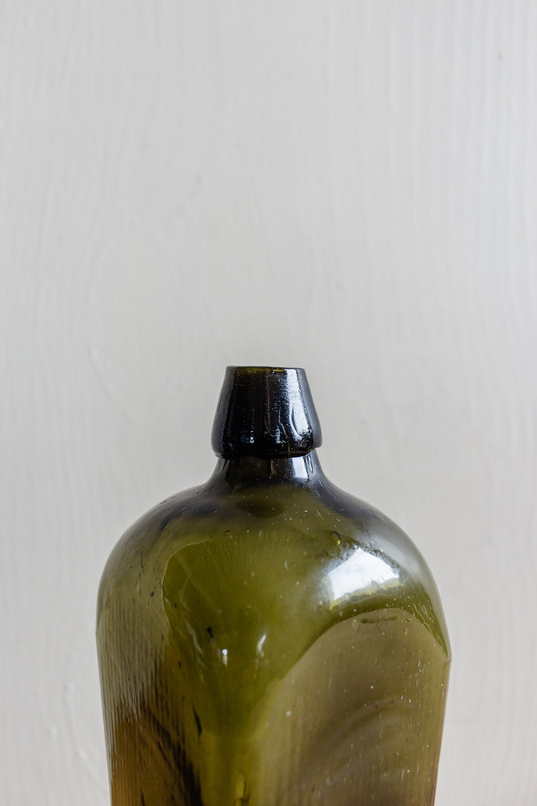 set of three antique green glass bottles