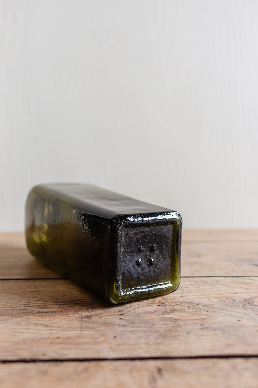 set of three antique green glass bottles