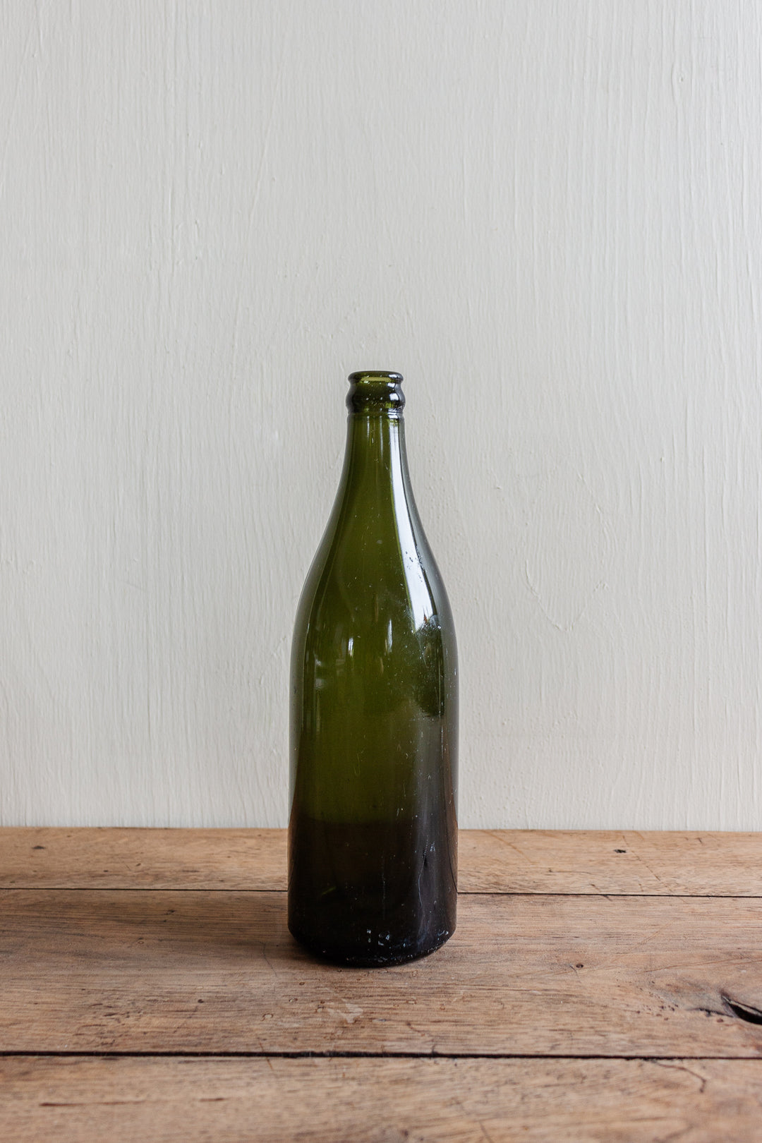 set of three antique green glass bottles