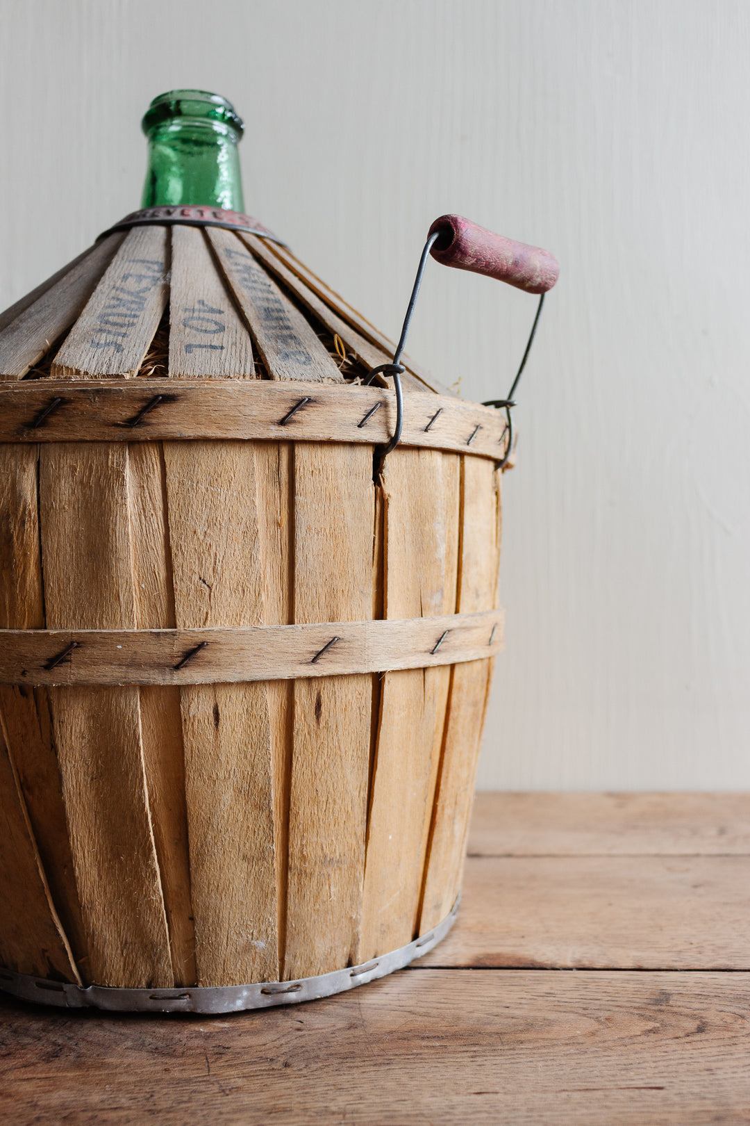 antique French Brevete Perrin & Fils Rognonas demijohn with wood strapping