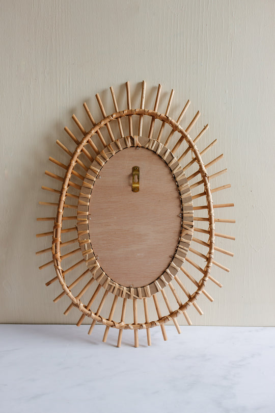 vintage French sunburst rattan mirror