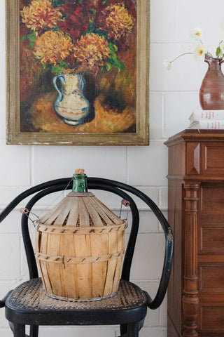 antique french demijohn in wood strapping