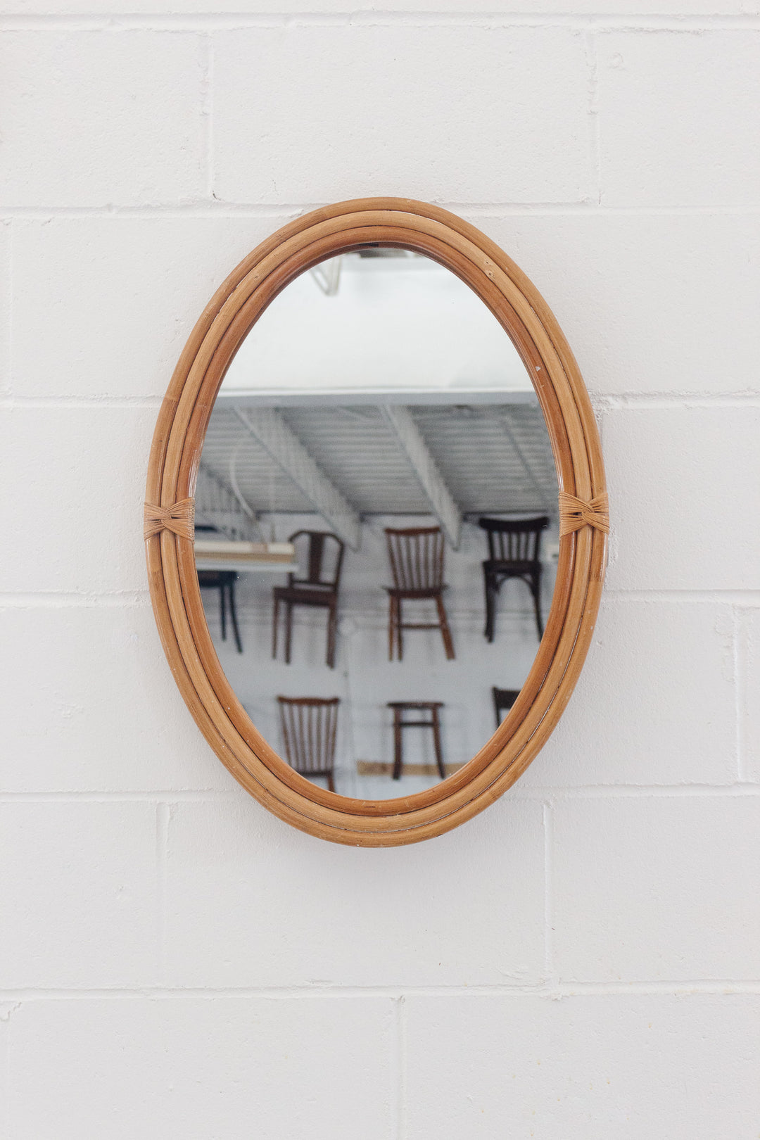 vintage french rattan oval mirror