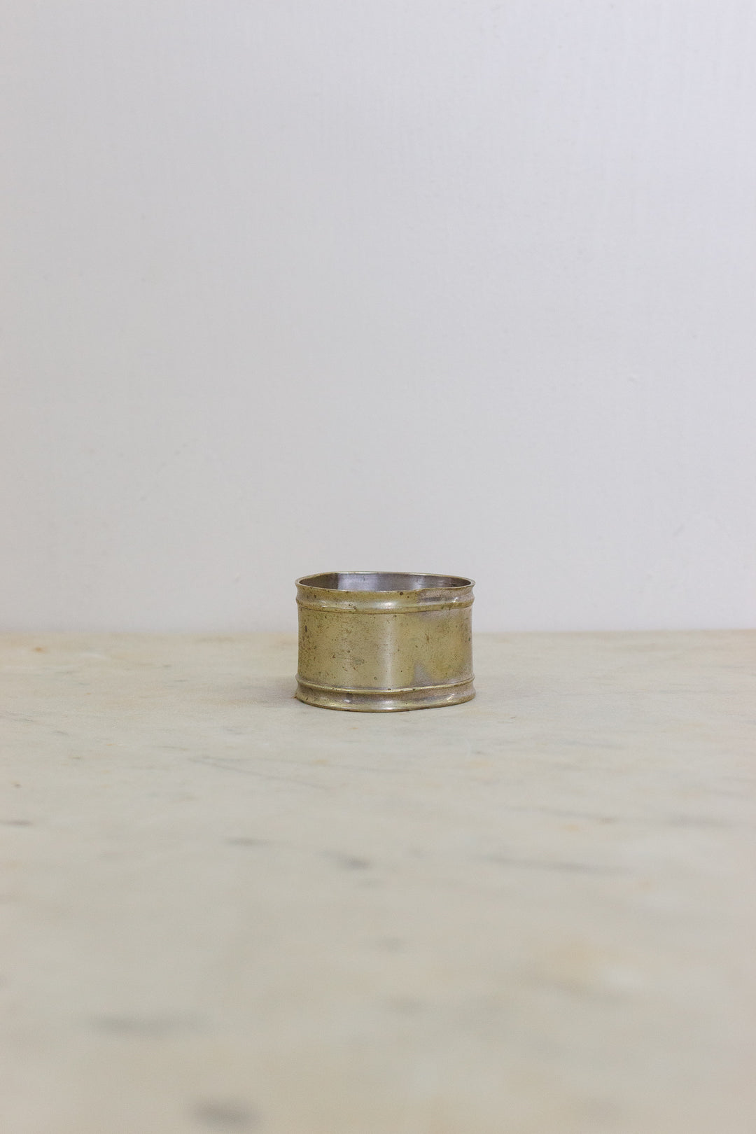 set of 5 assorted brass napkin rings