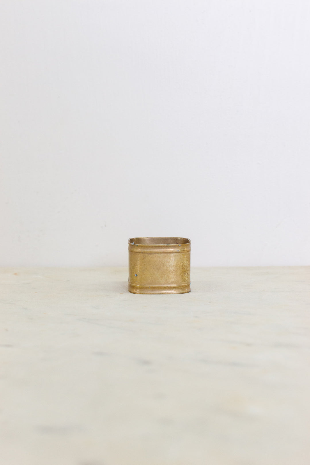 set of 5 assorted brass napkin rings