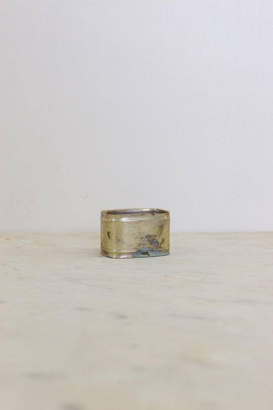 set of 5 assorted brass napkin rings