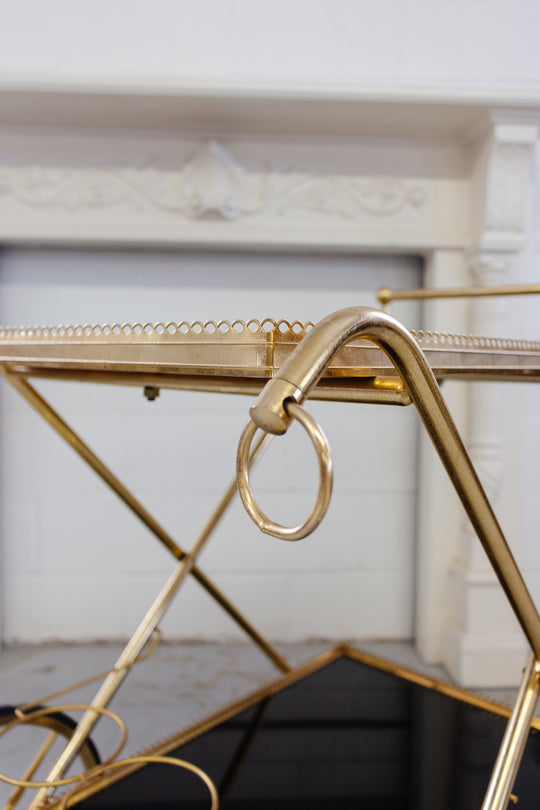 1970s French brass and smoky glass bar cart