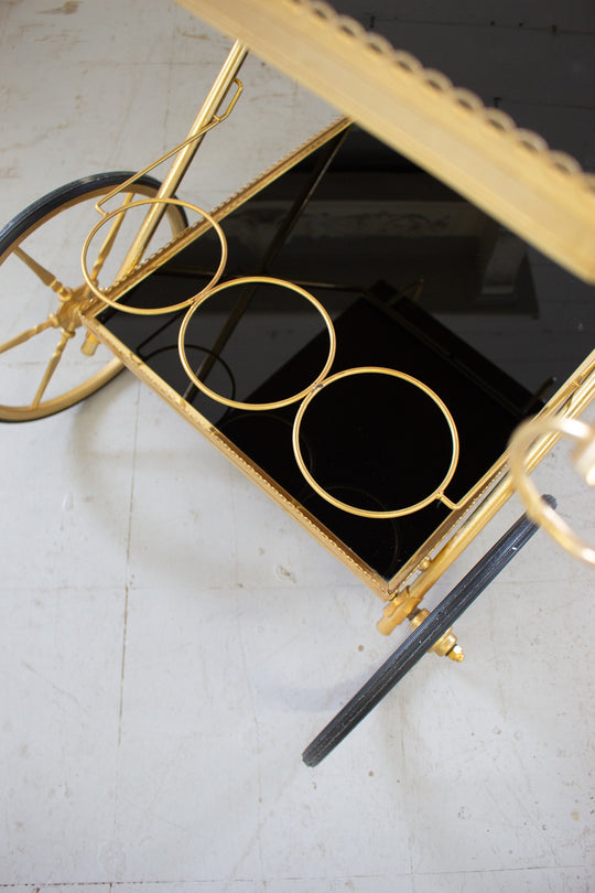 1970s French brass and smoky glass bar cart