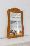 antique carved wood mirror with wavy glass