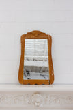 antique carved wood mirror with wavy glass
