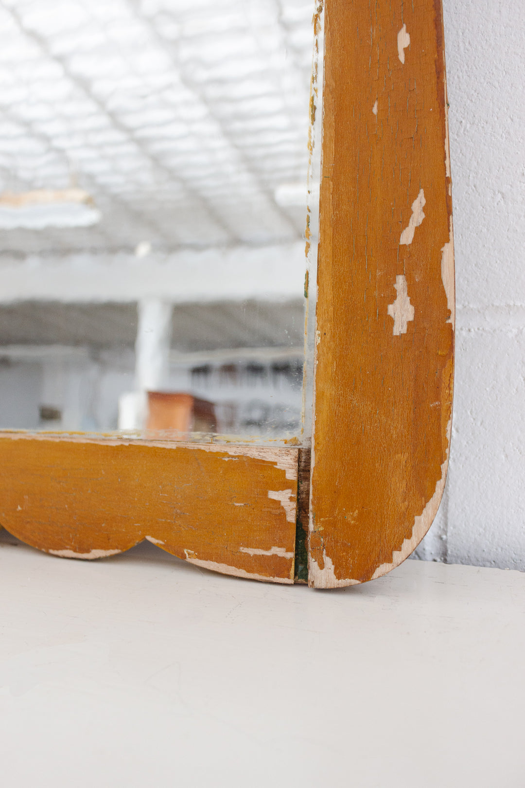 antique carved wood mirror with wavy glass