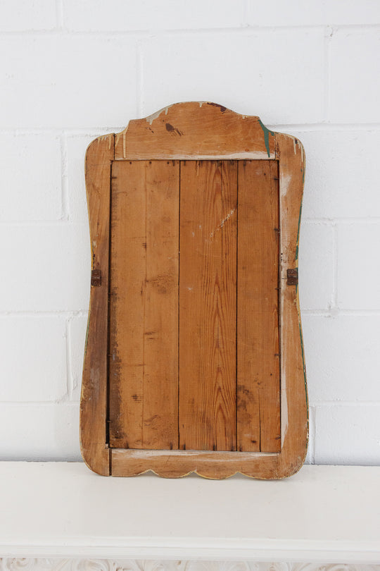 antique carved wood mirror with wavy glass