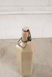 vintage french hexagonal stoneware bottle with porcelain lid