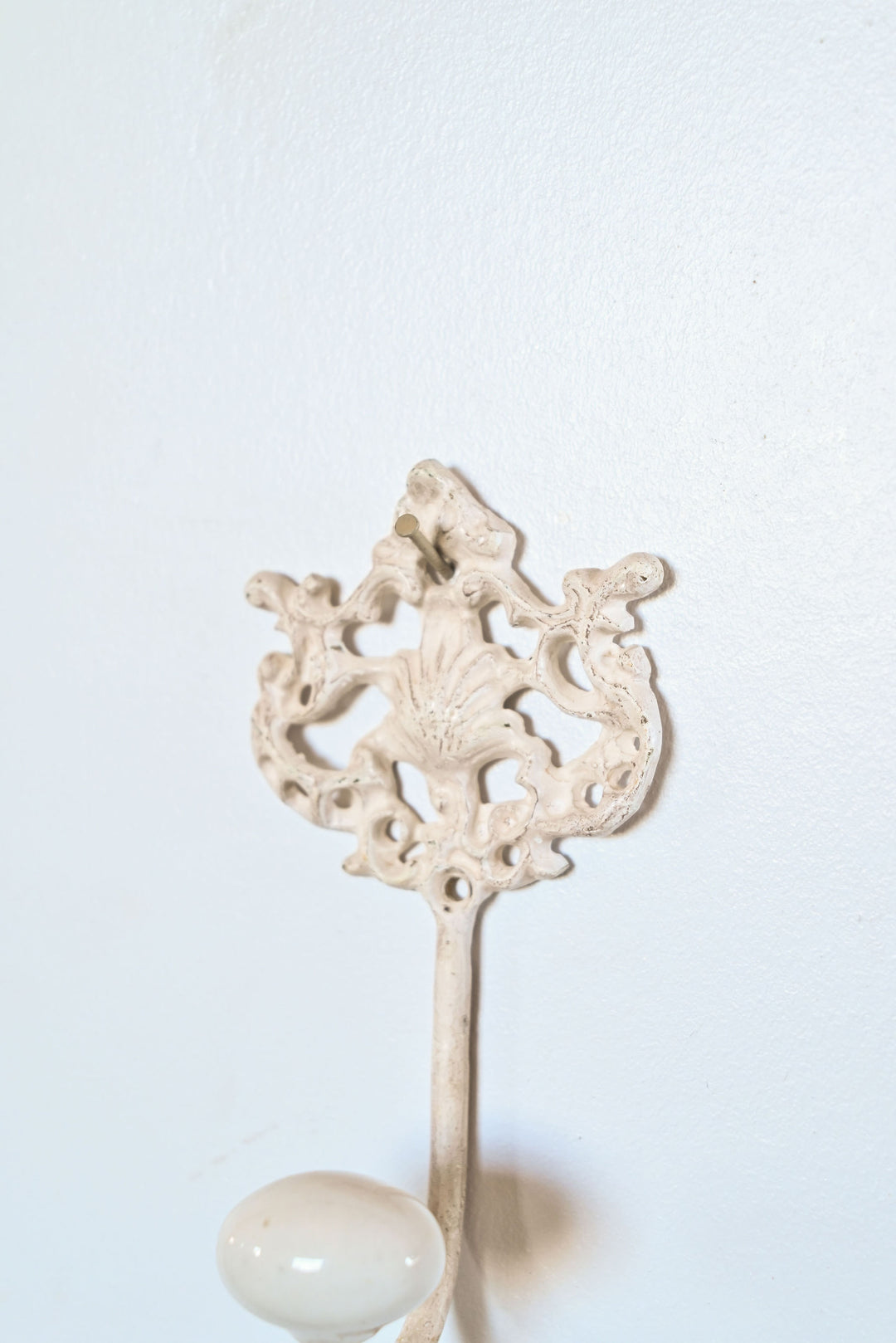 antique french cast iron and porcelain wall hook