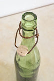 Antique french hand blown brasserie bottle with porcelain stopper