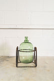 1970s french demijohn with wrought iron stand