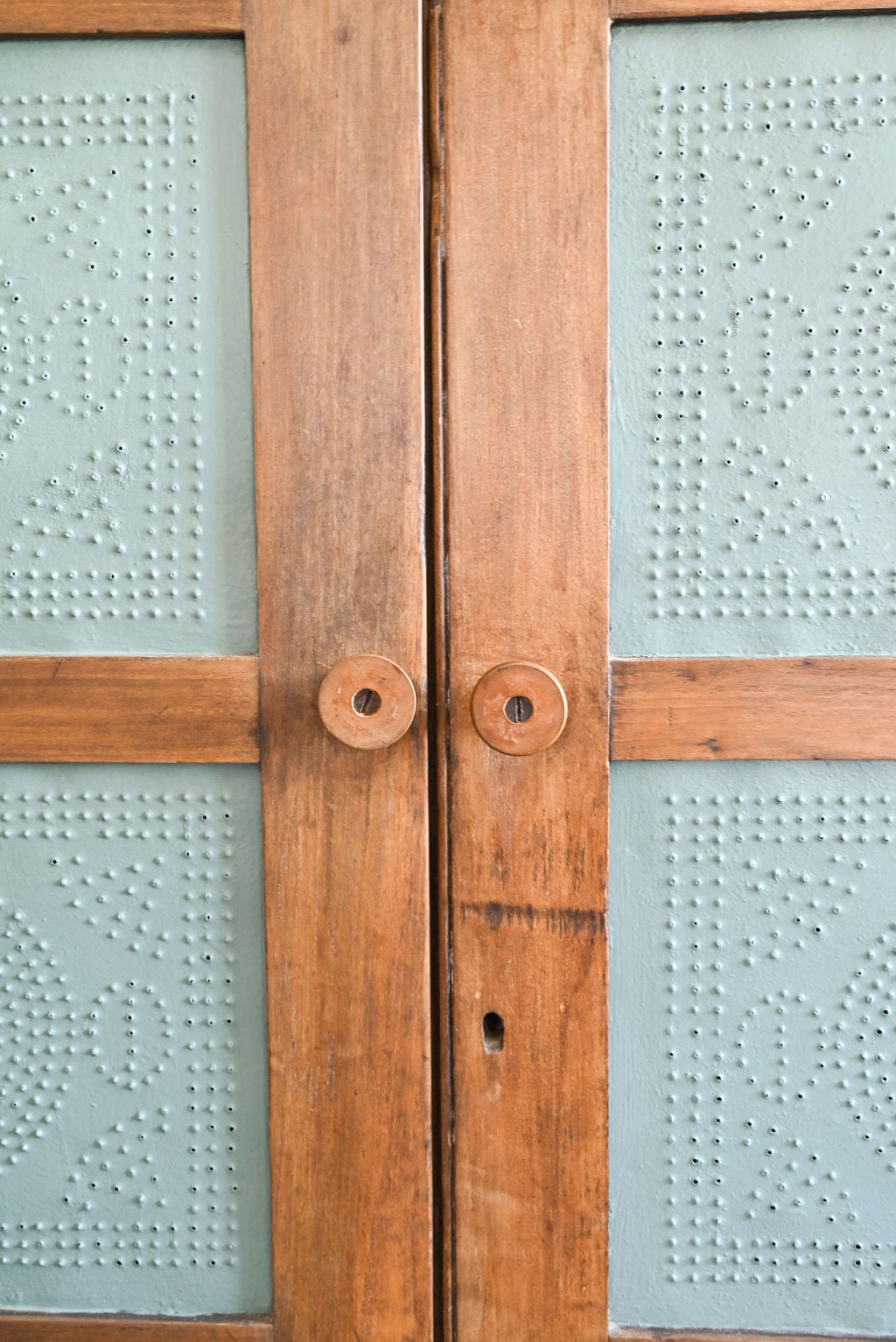 antique pie cupboard with pressed tin panels