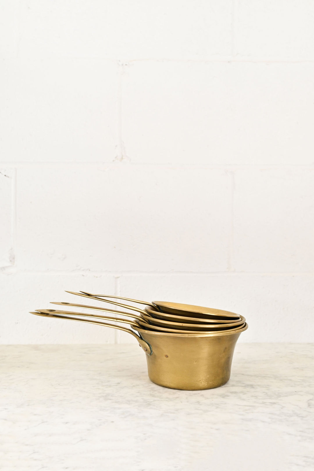 set of vintage French graduated brass measuring cups