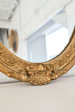 antique gilt wood and plaster ornate oval mirror
