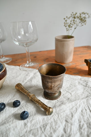 vintage  brass mortar and pestle with carved details