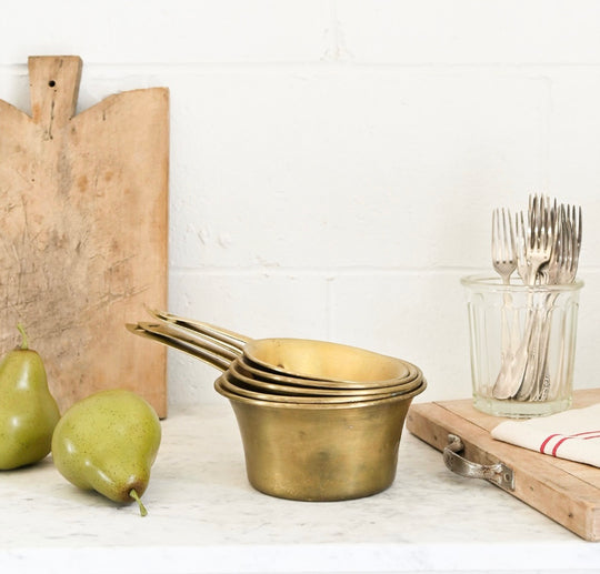 set of vintage French graduated brass measuring cups