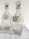 set of vintage French decanters and liquor tags